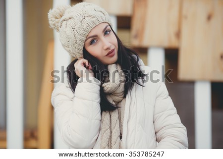 Woman warmly clothed in a cold winter on the b